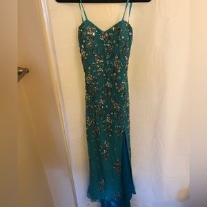 Turquoise formal dress with beautiful jewel and sequin embellishments. Worn once